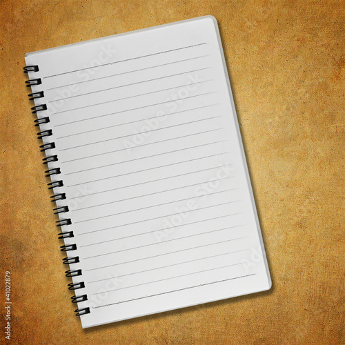 Blank notebook on old paper background