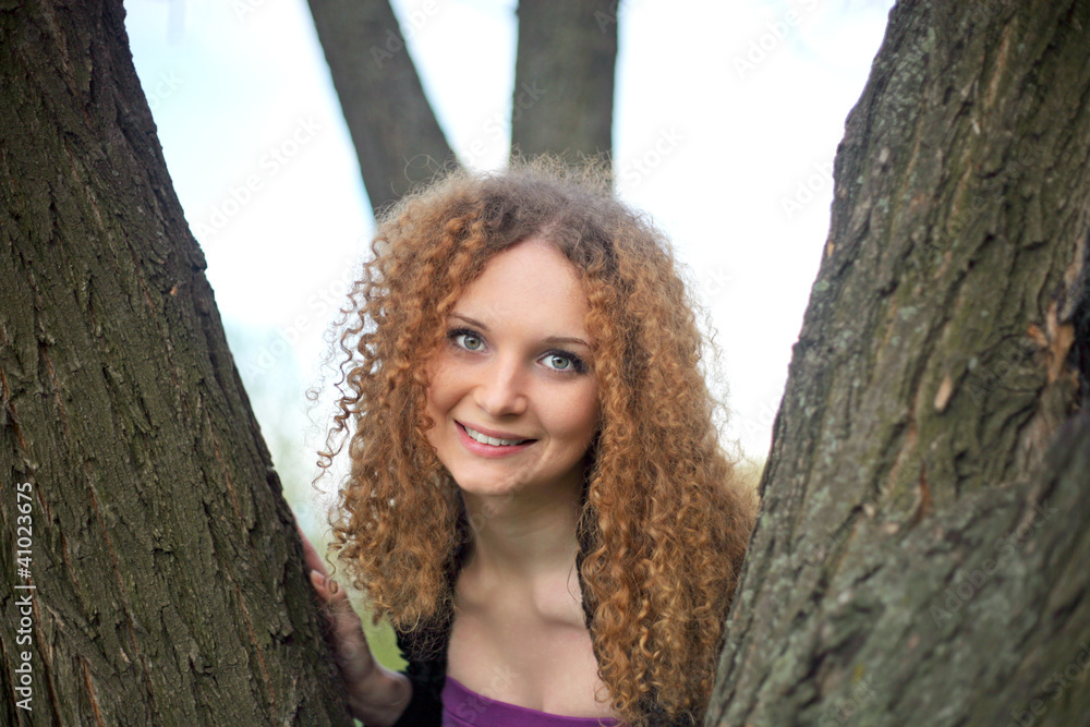 Portrait of a pretty girl in the trees Portrait of a pretty girl in the trees