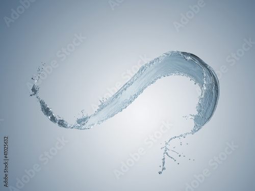 Water splashes against light blue background