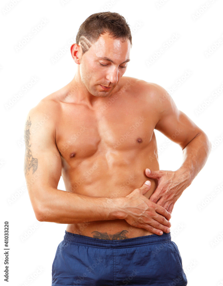 A muscular man having pain in the small of his back