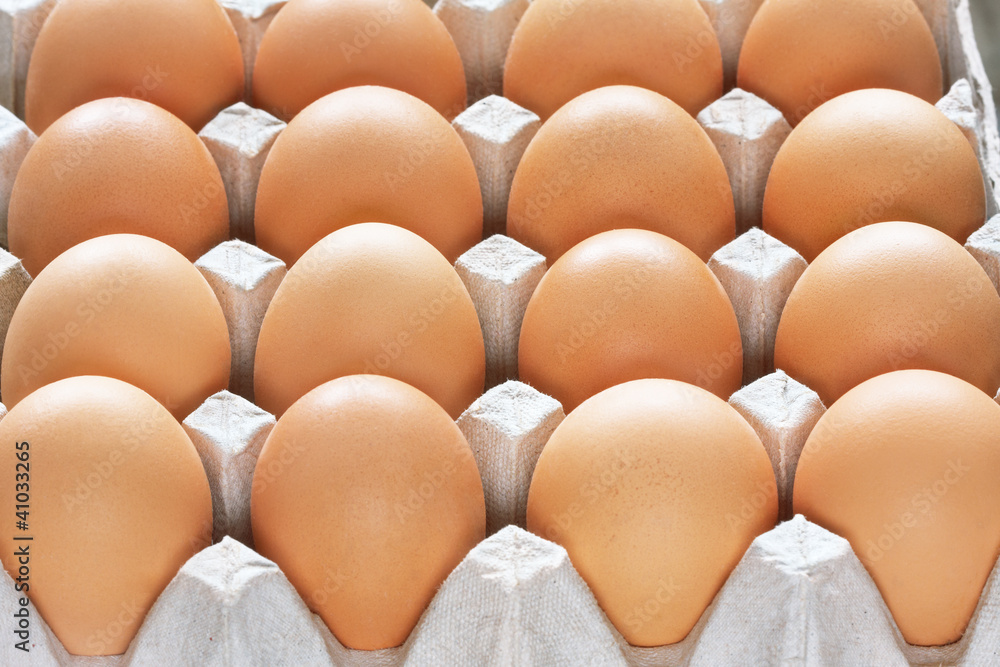 Many brown eggs in carton tray Many brown eggs in carton tray