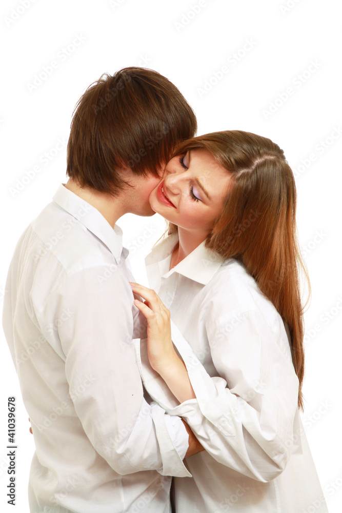 The man and the woman embrace. Isolated on the white background The man and the woman embrace. Isolated on the white background