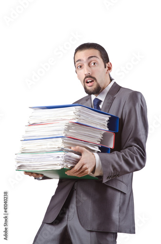 Businessman with stack of folders