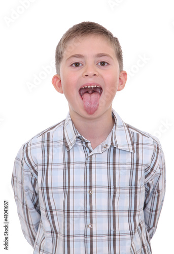 Boy with tongue out of mouth