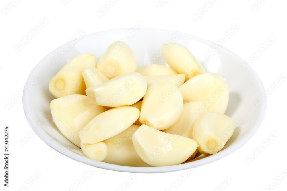 Garlics of white plate