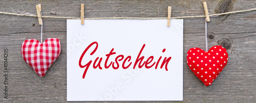 Gutschein mit roten Herzen photo