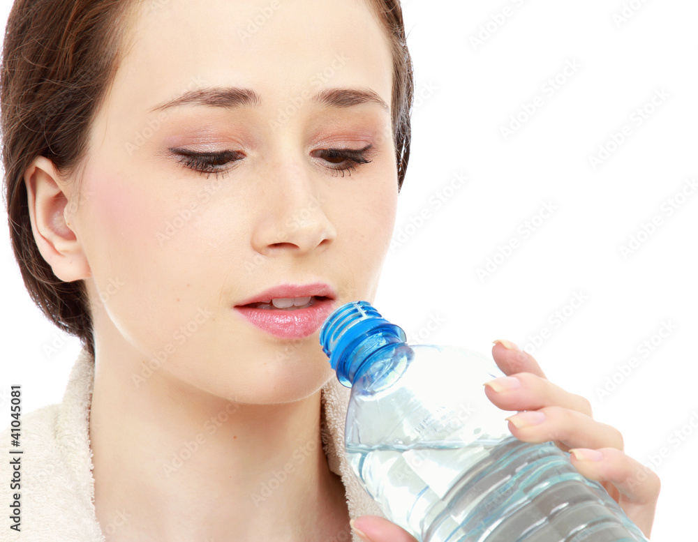 A woman drinking water, isolated on white background A woman drinking water, isolated on white background