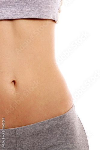 A slim girl, focus on her belly