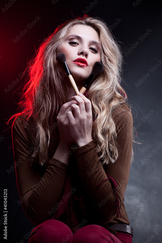 Portrait of beautiful woman with makeup brushes Portrait of beautiful woman with makeup brushes