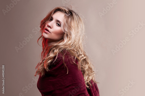Portrait of fashion woman in dress on natural background