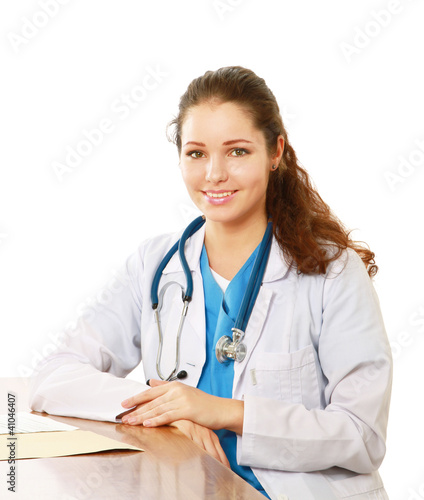 Female doctor working at desk, isolated on white background