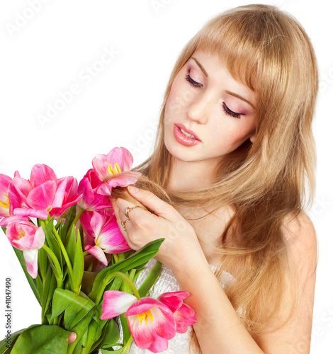 Picture of happy young blonde woman with colorful flowers