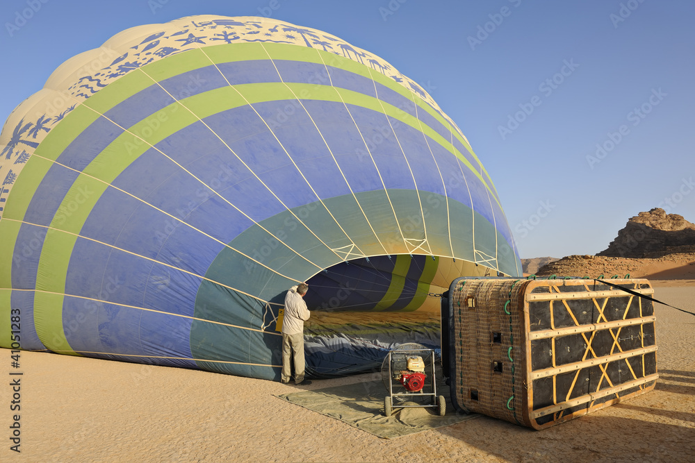 Naklejka premium Pre-flight hot-air balloon inflation in the desert of Wadi Rum,