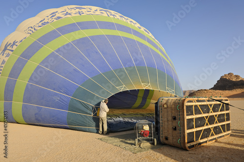 Pre-flight hot-air balloon inflation in the desert of Wadi Rum,