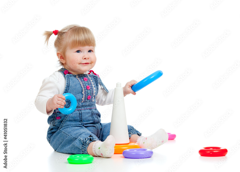 child playing with colourful pyramid child playing with colourful pyramid