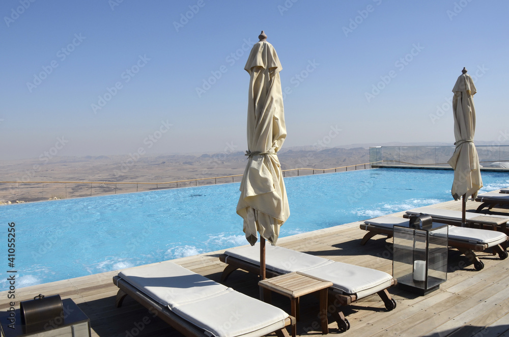 Obraz premium Pool solarium in tourist hotel, Negev desert.