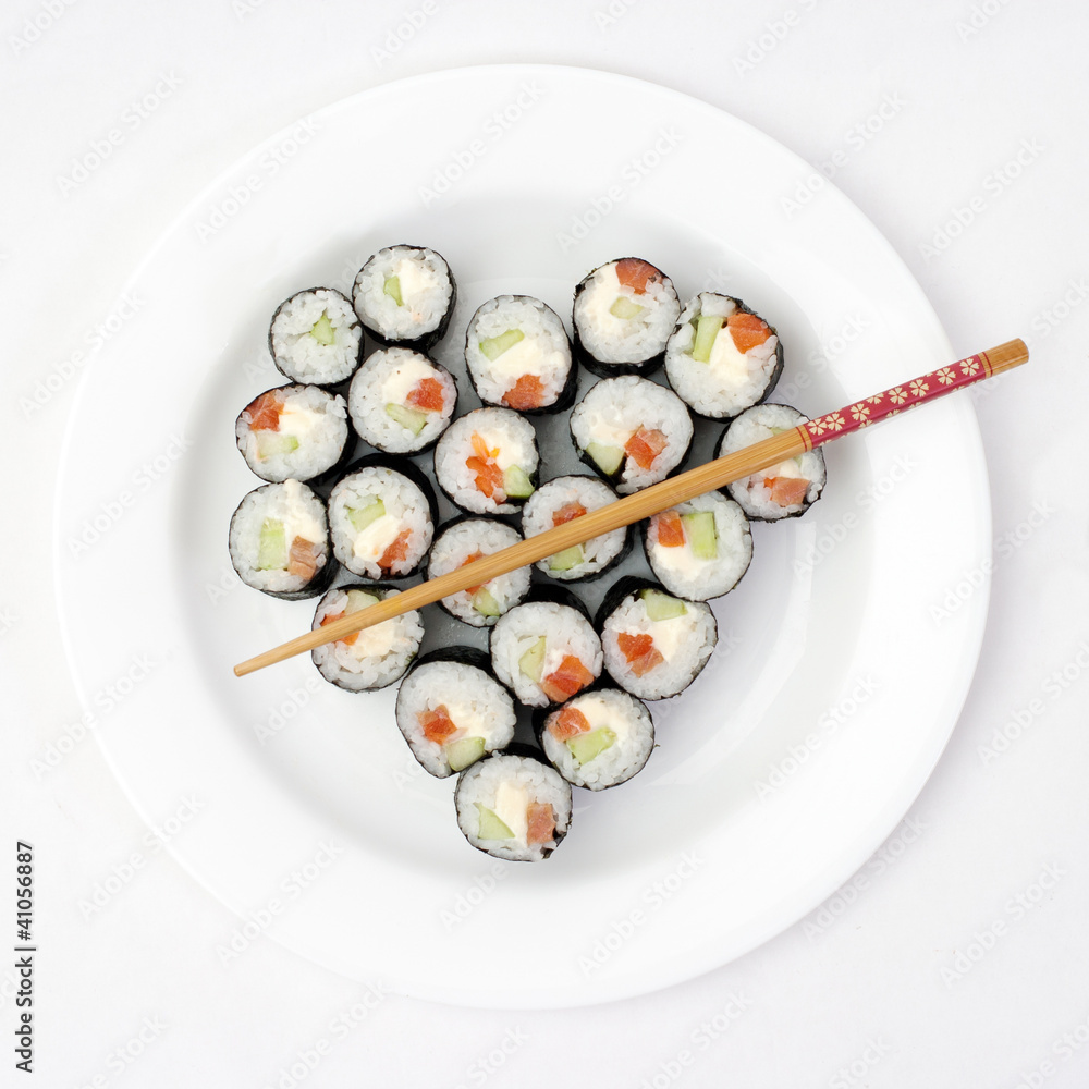 Sushi on a plate in the shape of heart Sushi on a plate in the shape of heart