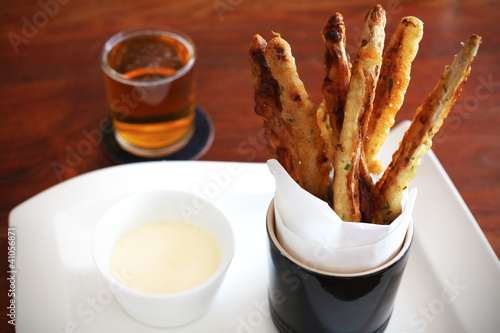 Картината върху платно Asparagus batter fried served with mayonnaise and beer