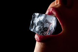 Ice cube in woman's mouth.
