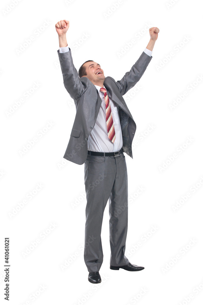 Excited handsome business man with arms raised in success Excited handsome business man with arms raised in success