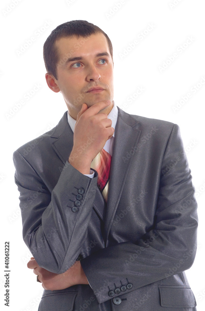 Closeup of a handsome young business man thinking about Closeup of a handsome young business man thinking about