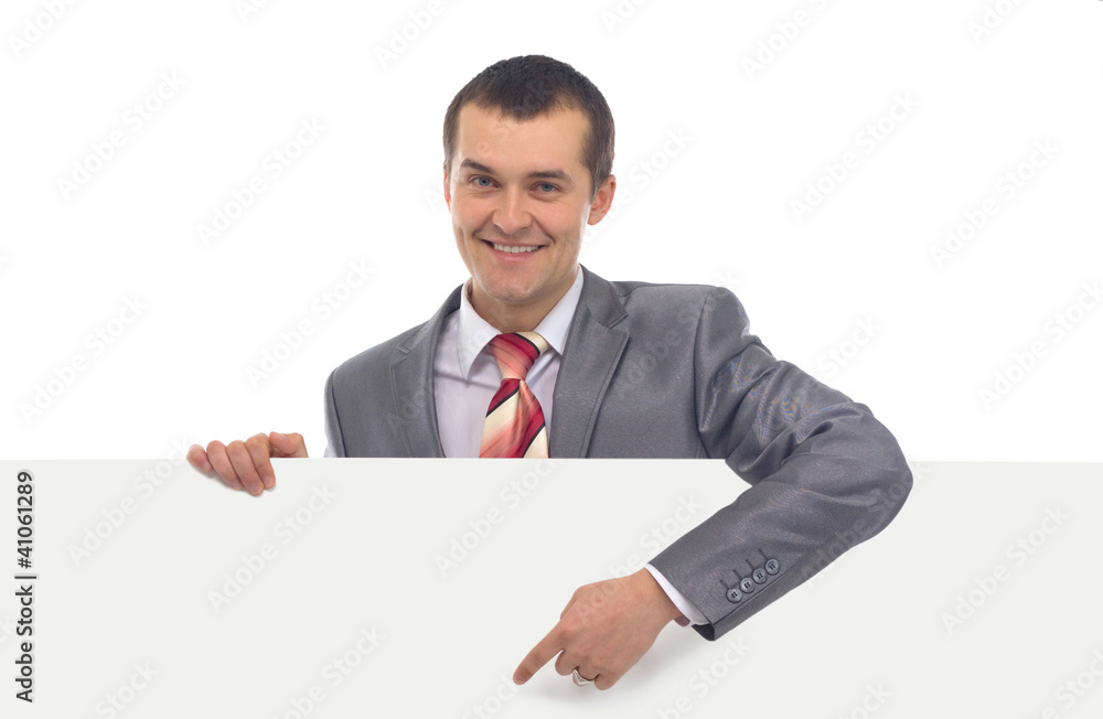 Happy smiling young business man showing blank signboard Happy smiling young business man showing blank signboard