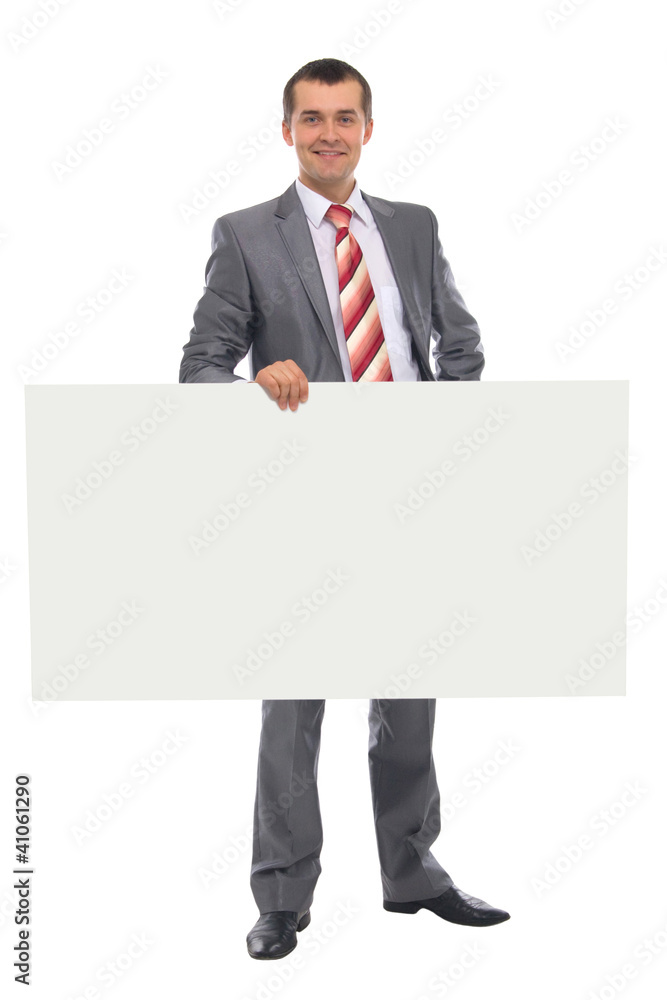Happy smiling young business man showing blank signboard Happy smiling young business man showing blank signboard
