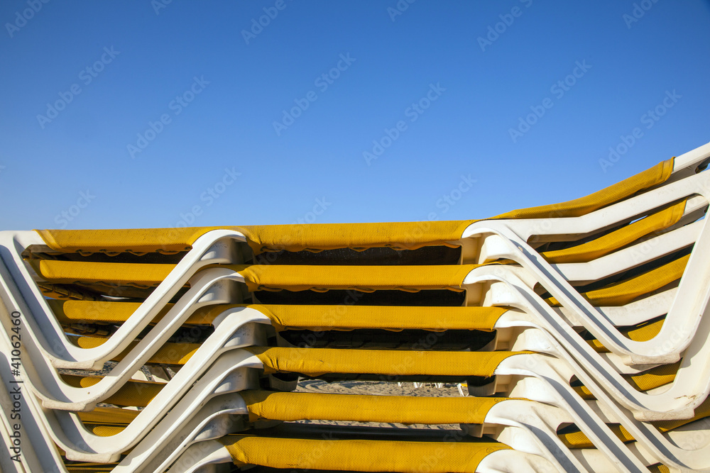 structure of stapled beach beds in the morning at the beach structure of stapled beach beds in the morning at the beach