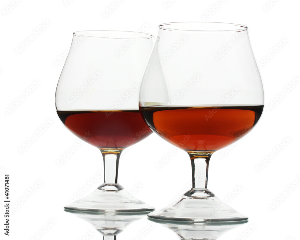 Two glasses of cognac isolated on white Two glasses of cognac isolated on white
