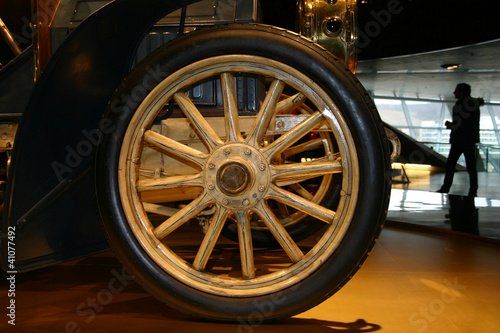 Wheel from the ancient car and the person