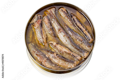 Tin can with sprats on white