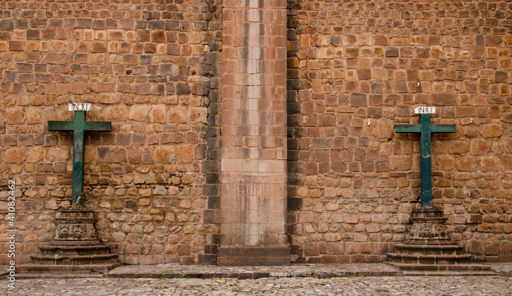Two crosses at the outer wall of the Cathedral in Cusco, Peru