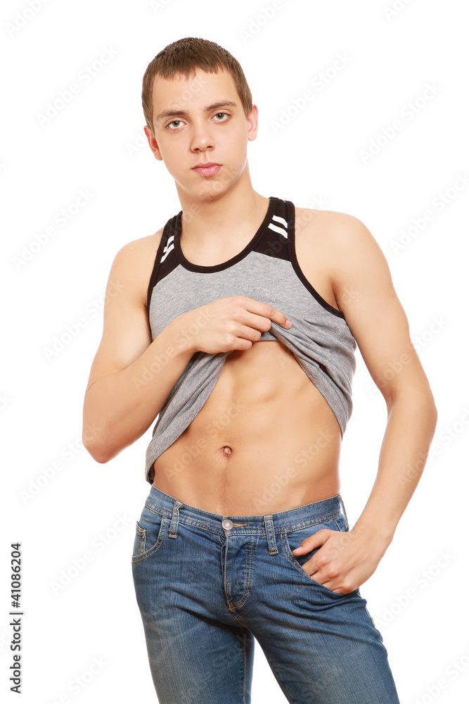 Portrait of a young man showing his abdomen Portrait of a young man showing his abdomen