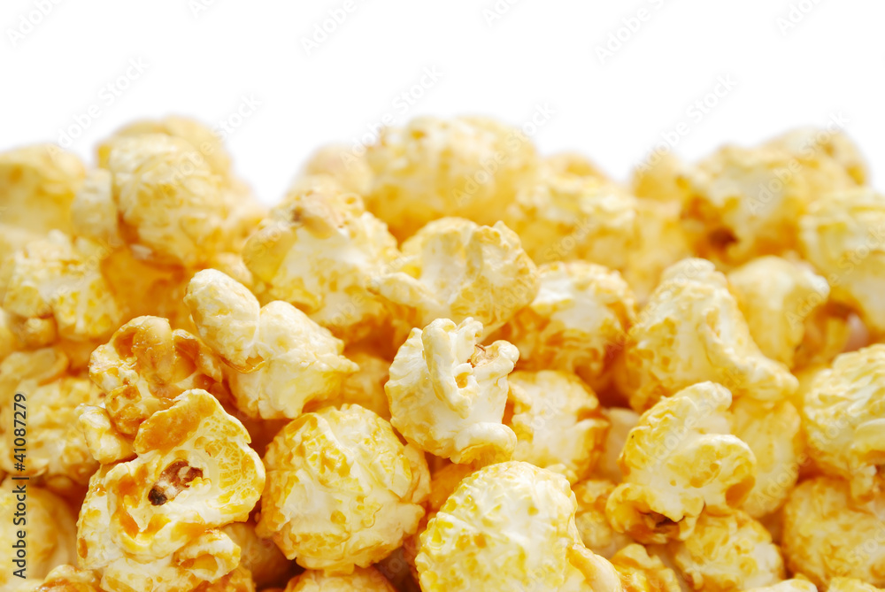 The heap of popcorn isolated on white background The heap of popcorn isolated on white background