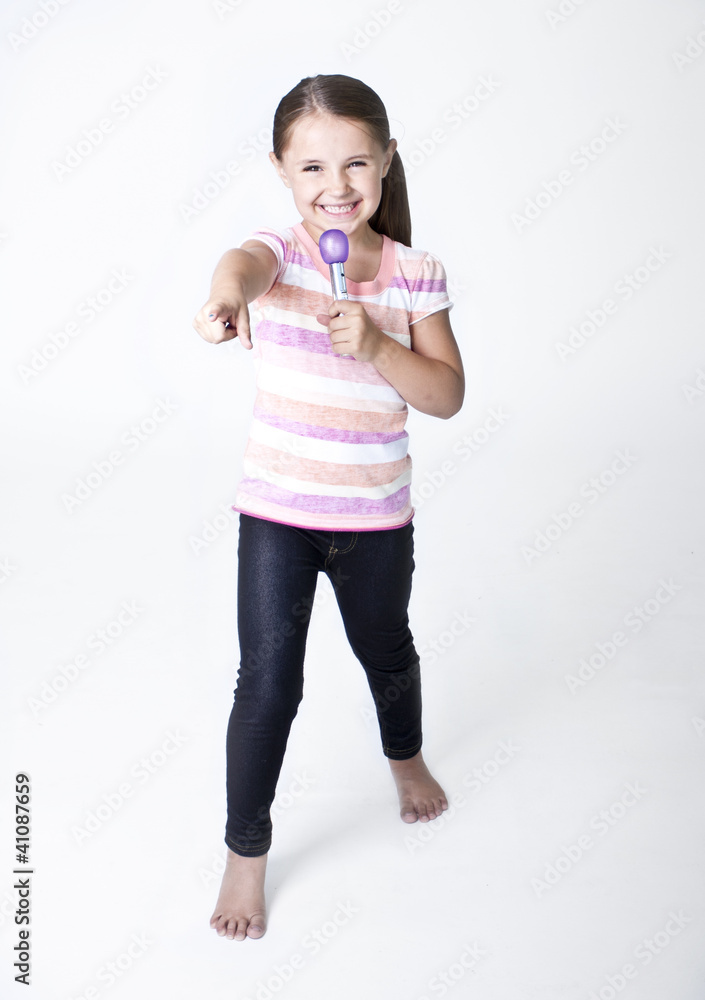 Cute little Pop Star singing on white background Cute little Pop Star singing on white background