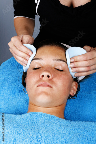 Young girl getting a facial