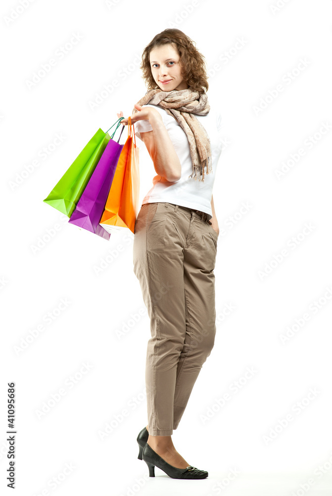 Beautiful young woman holding shopping bags