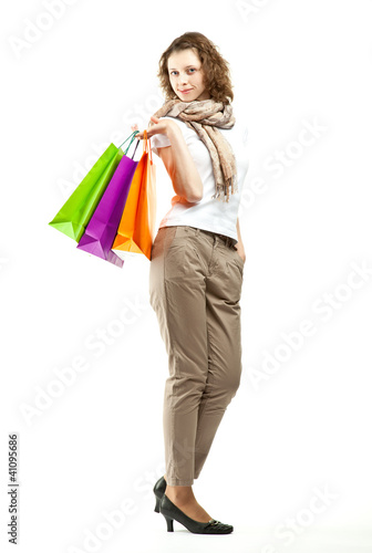 Beautiful young woman holding shopping bags