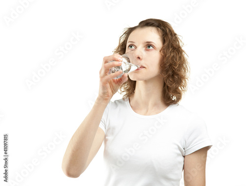 Young woman drinking clear water