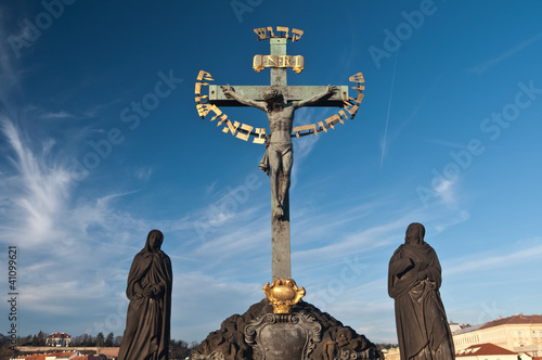 Religious detail of Charles' Bridge in Prague, Czech Republich photo