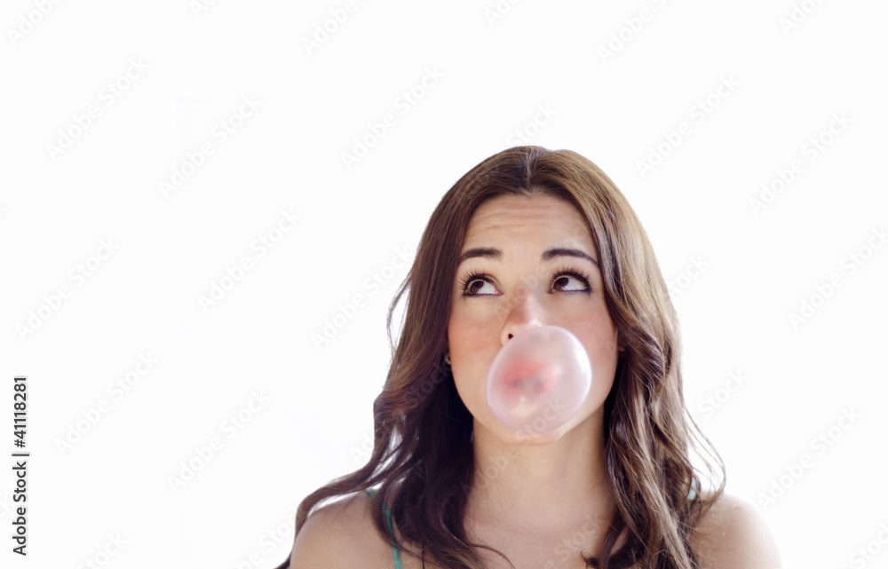 Cute young girl making a bubble with gum Cute young girl making a bubble with gum