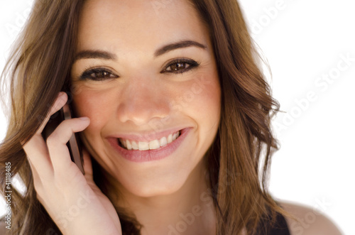 Cute young girl talking on the phone