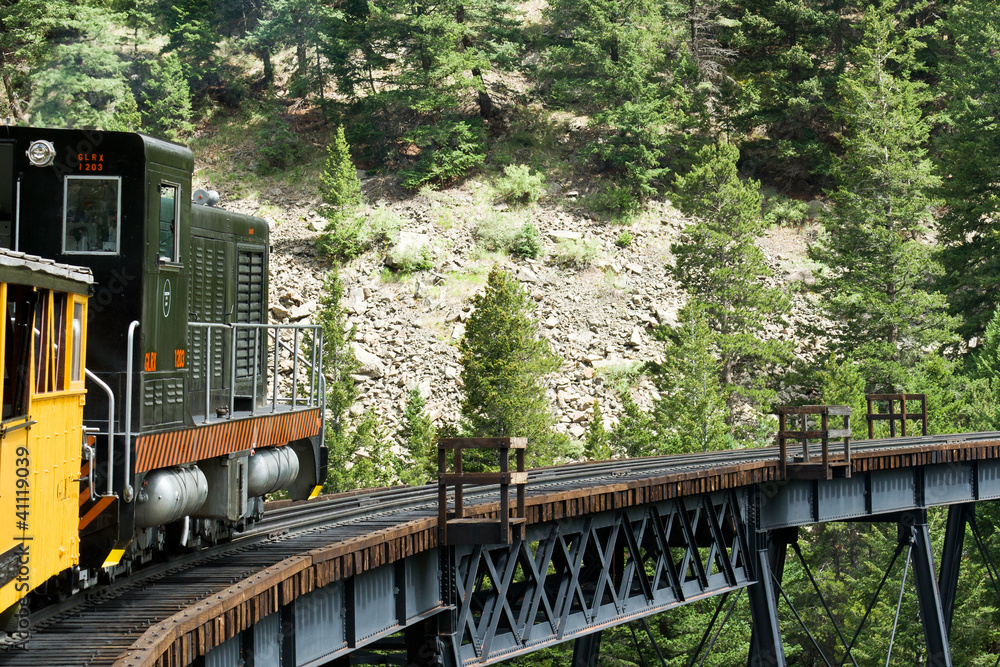 Fototapeta premium Historic Steam Train Coming Down The Tracks