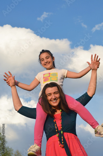 happy young woman mother play and outdoor with beautiful child