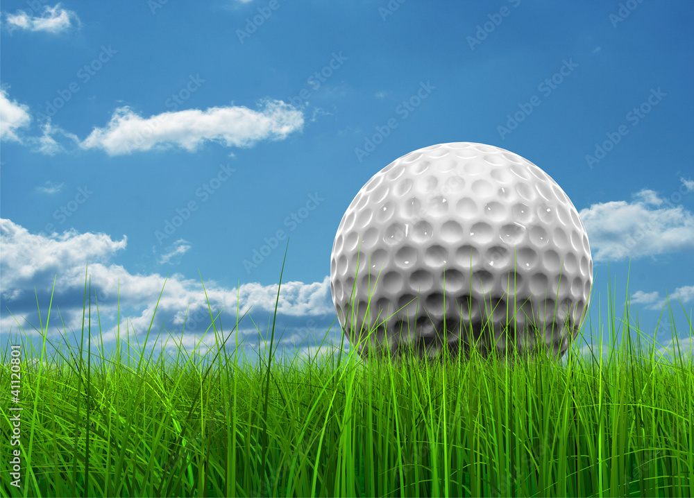 Conceptual golf ball in grass over a blue sky Conceptual golf ball in grass over a blue sky