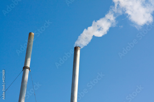 heating boiler chimney smoky in blue sky background