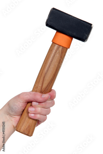 female hand holding hammer