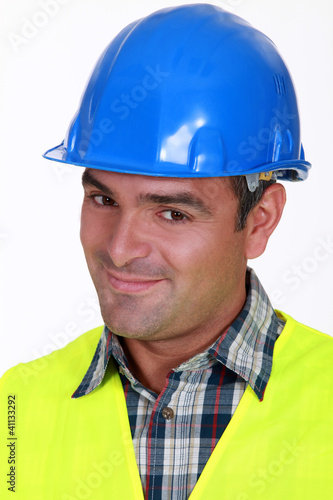 Close-up shot of a smiling tradesman