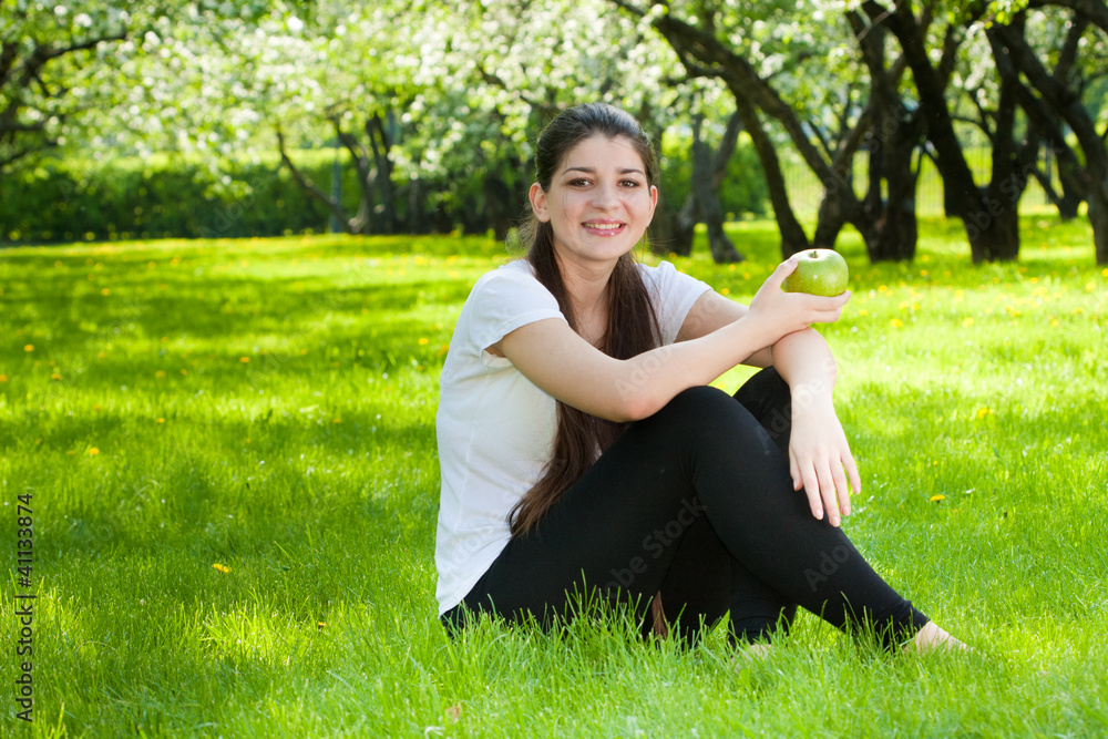 The long-haired girl against blossoming apple-trees. The long-haired girl against blossoming apple-trees.