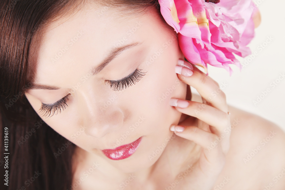 Beauty face of the young beautiful woman with flower Beauty face of the young beautiful woman with flower